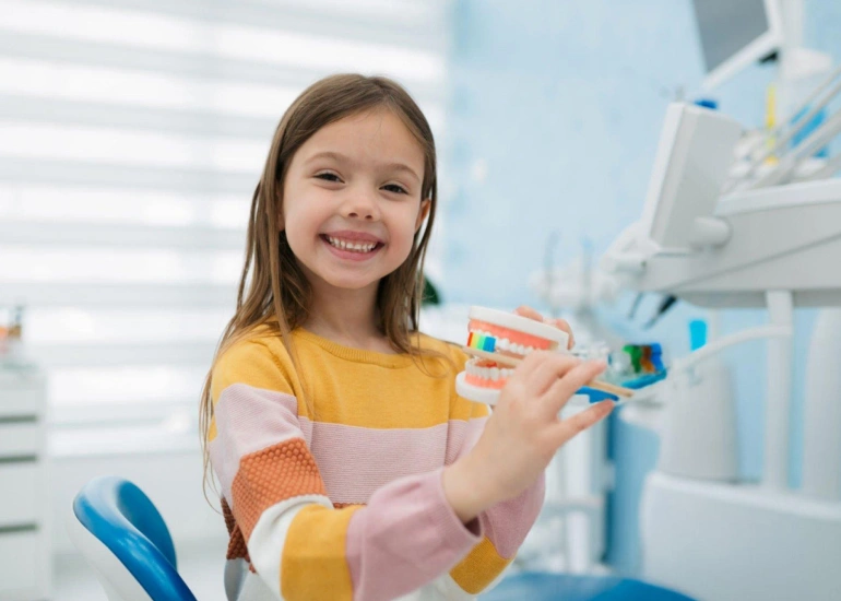 after getting dental treatment at city edge dental a child is really happy